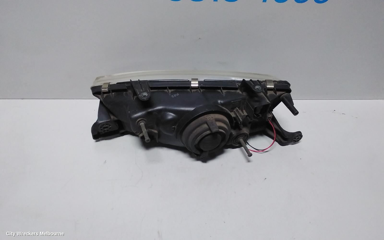 SUBARU LIBERTY RIGHT HEADLAMP, 2ND GEN, KOITO LENS# 100-20588, 06/1994 - 01/1999