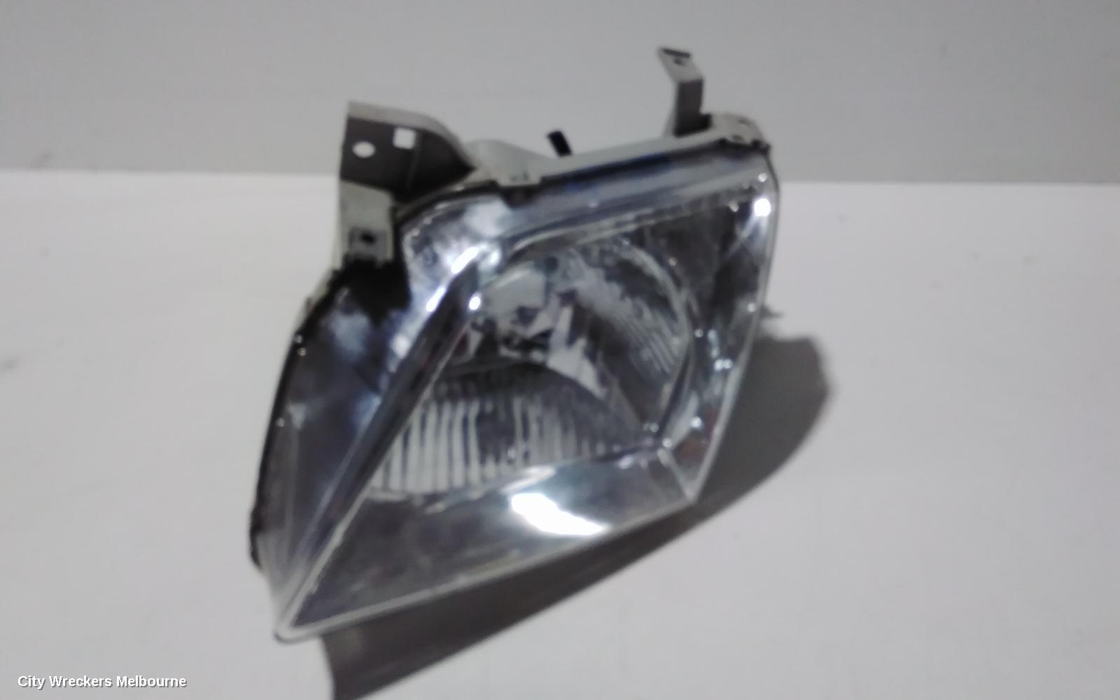 MAZDA MPV LEFT HEADLAMP, LW, LENS # STANLEY R6899, 08/1999 - 05/2002