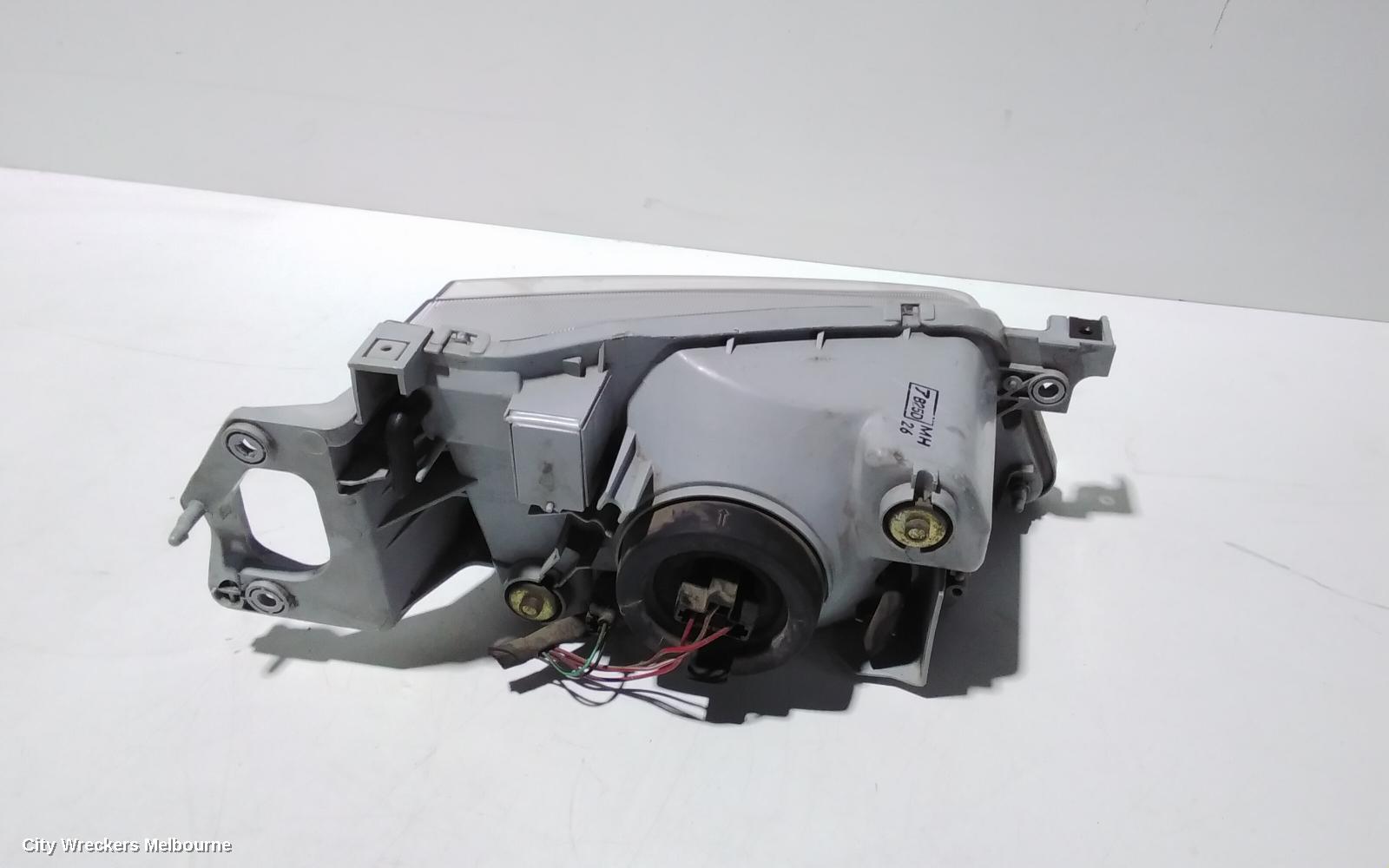 MAZDA 323 LEFT HEADLAMP, BJ, P/N B25D510L0, 09/1998 - 03/2001