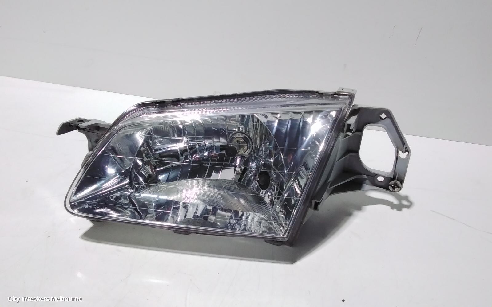 MAZDA 323 LEFT HEADLAMP, BJ, P/N B25D510L0, 09/1998 - 03/2001