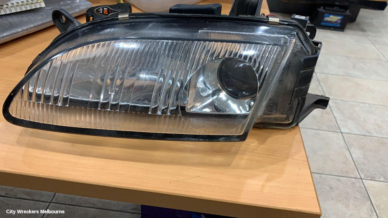 MAZDA ASTINA LEFT HEADLAMP, BA 4DR (KOITO 110-61719) 06/1994 - 08/1998