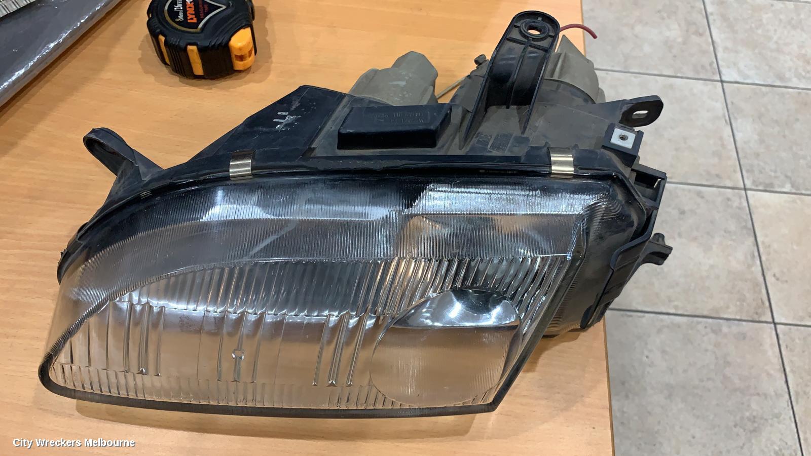 MAZDA ASTINA LEFT HEADLAMP, BA 4DR (KOITO 110-61719) 06/1994 - 08/1998