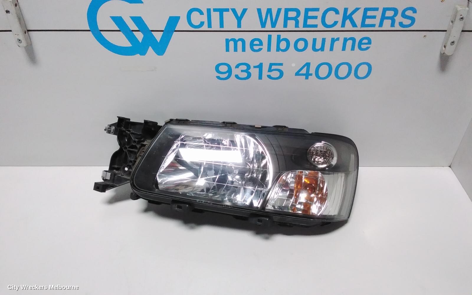 SUBARU FORESTER LEFT HEADLAMP, BLACK INSERT (CURVED LINES), LENS# 1700, 08/2004 - 05/2005