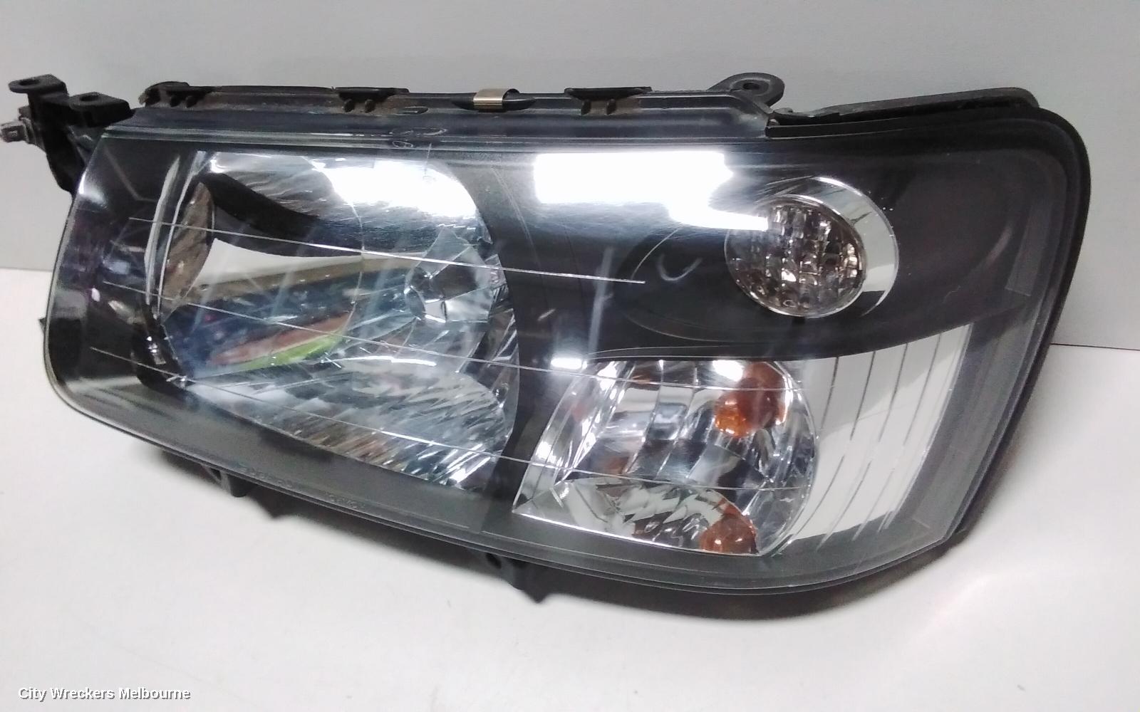 SUBARU FORESTER LEFT HEADLAMP, BLACK INSERT (CURVED LINES), LENS# 1700, 08/2004 - 05/2005
