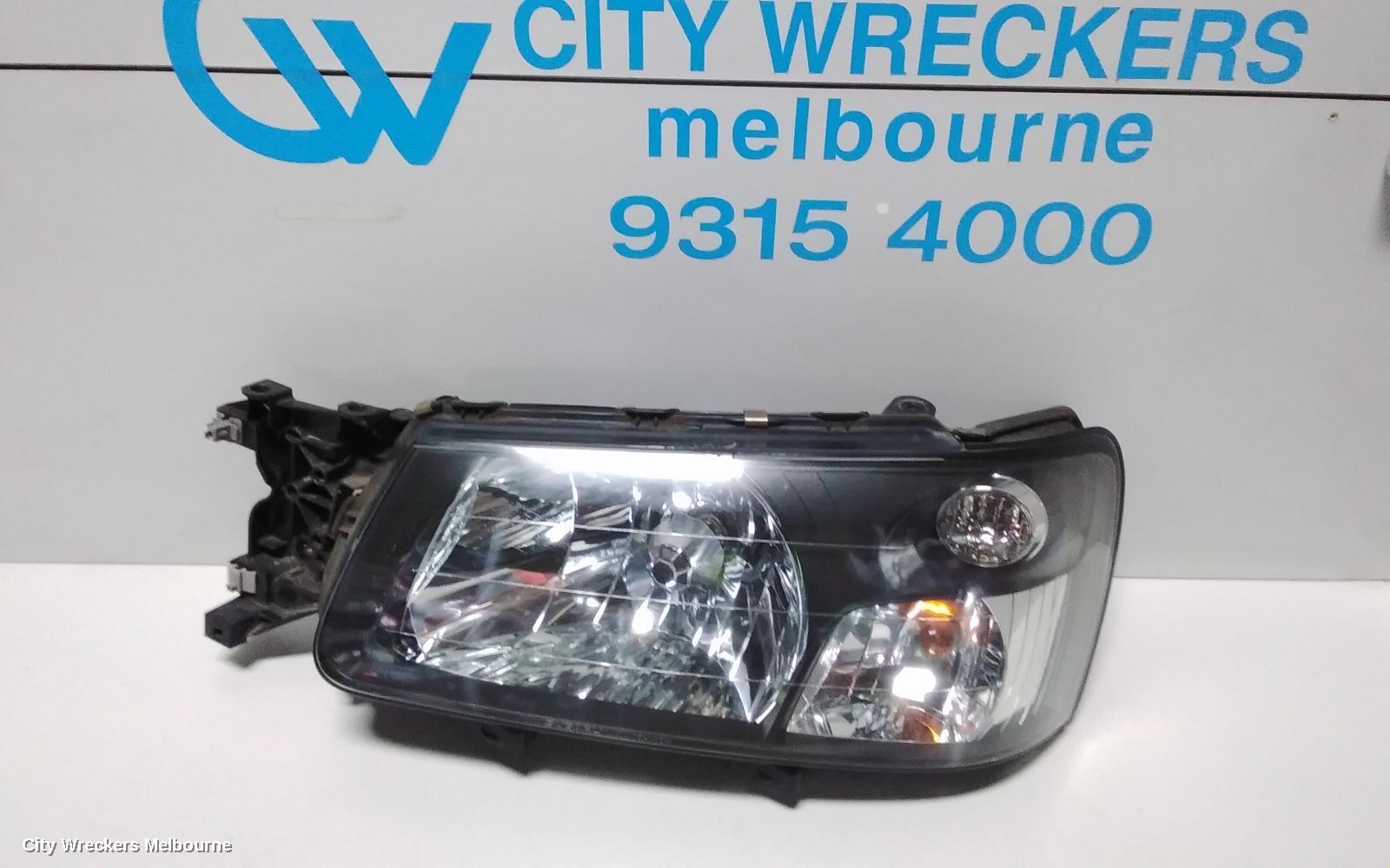 SUBARU FORESTER LEFT HEADLAMP, BLACK INSERT (CURVED LINES), LENS# 1700, 08/2004 - 05/2005