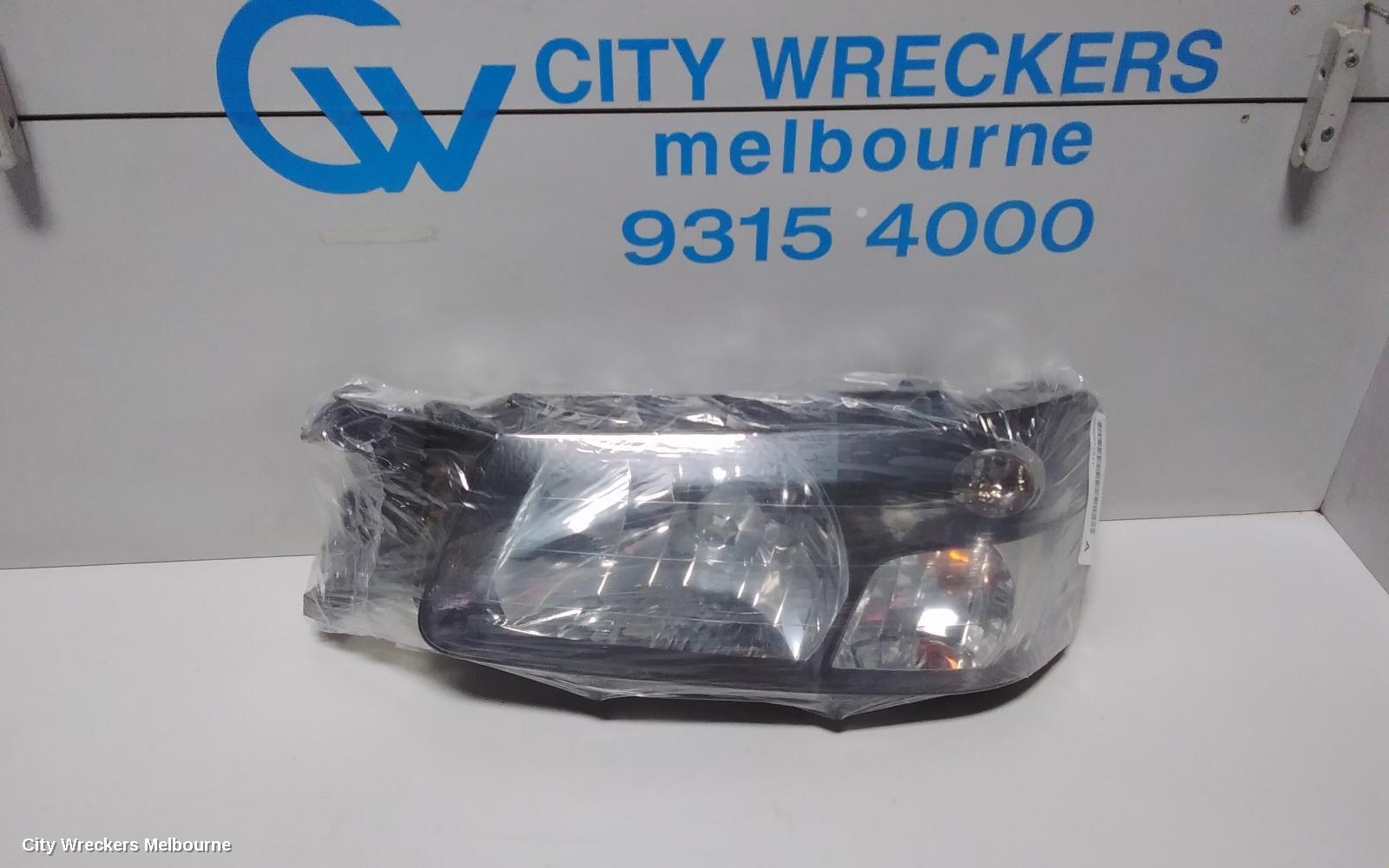 SUBARU FORESTER LEFT HEADLAMP, BLACK INSERT (CURVED LINES), LENS# 1700, 08/2004 - 05/2005