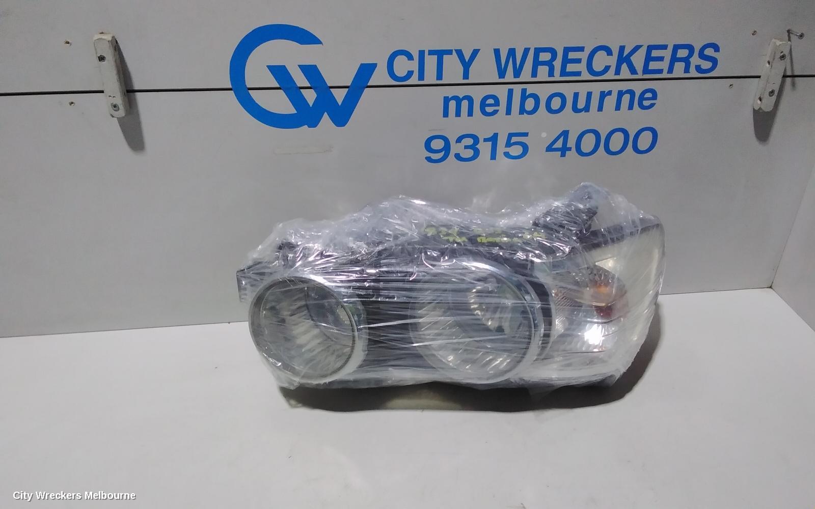 HOLDEN BARINA LEFT HEADLAMP, TM, W/ CHROME RING TYPE, 08/2011 - 08/2016