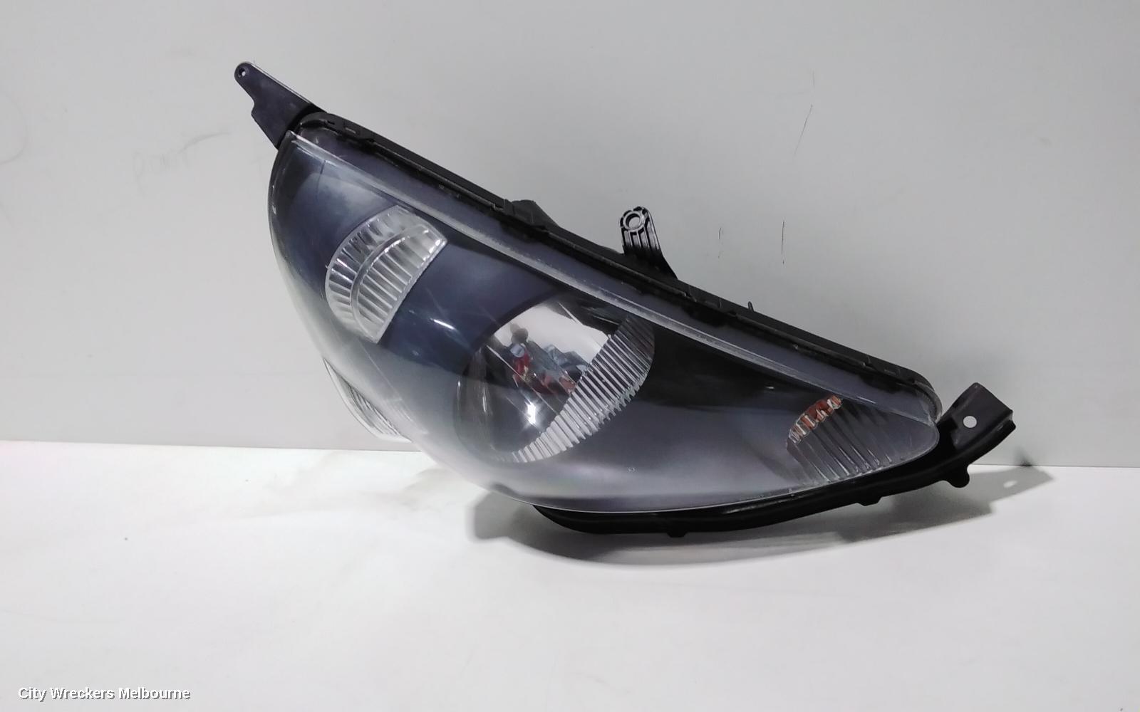 HONDA JAZZ RIGHT HEADLAMP, GD, 1.5 ENG, BLACK INNER, CHROME INSERT TYPE, MANUAL ADJ, LENS# 4944, 10/2004 - 09/2008